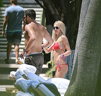 Lauren Stoner in red bikini poolside in Miami