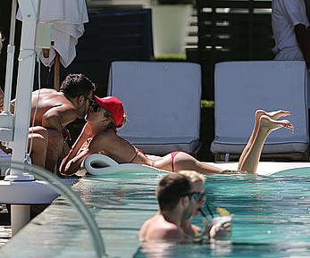 Lauren Stoner in red bikini poolside in Miami