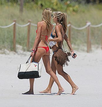 Lauren Stoner in red bikini poolside in Miami