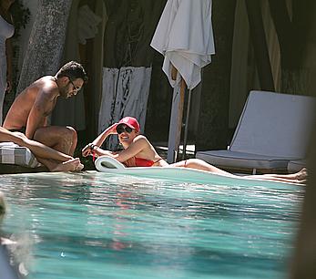 Lauren Stoner in red bikini poolside in Miami