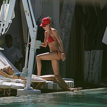 Lauren Stoner in red bikini poolside in Miami