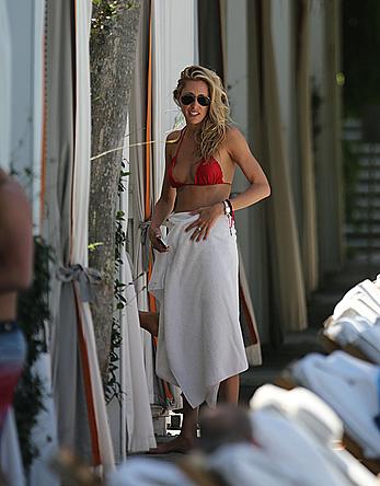 Lauren Stoner in red bikini poolside in Miami