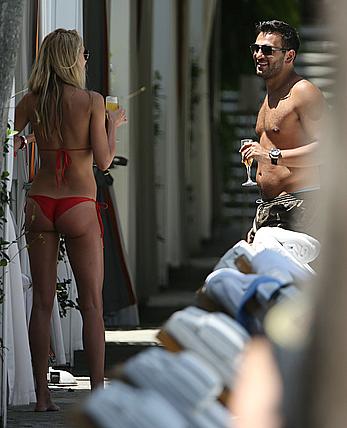 Lauren Stoner in red bikini poolside in Miami