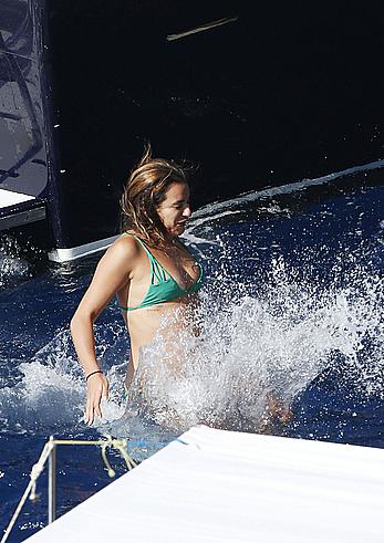 Lea Michele nipple slip in green bikini on a boat in Italy