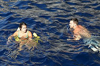 Lea Michele nipple slip in green bikini on a boat in Italy