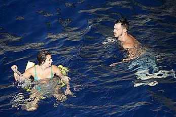 Lea Michele nipple slip in green bikini on a boat in Italy