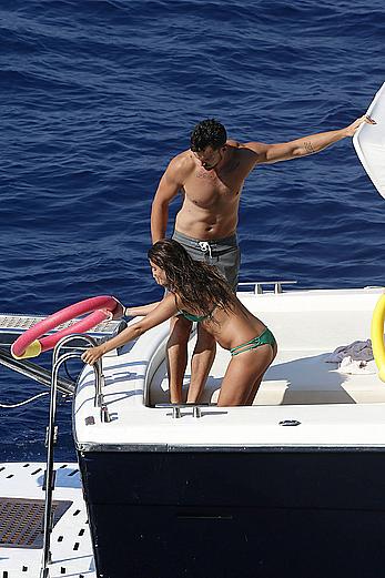 Lea Michele nipple slip in green bikini on a boat in Italy