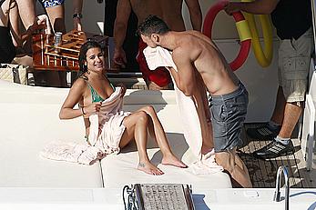 Lea Michele nipple slip in green bikini on a boat in Italy