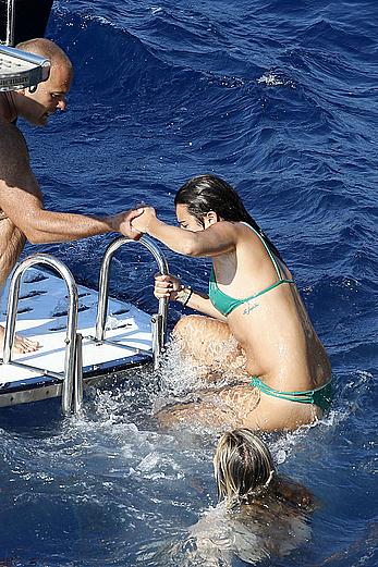 Lea Michele nipple slip in green bikini on a boat in Italy