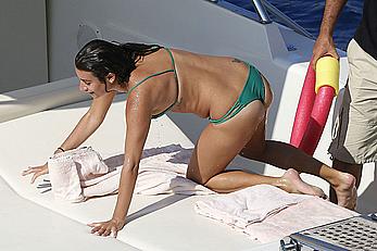 Lea Michele nipple slip in green bikini on a boat in Italy