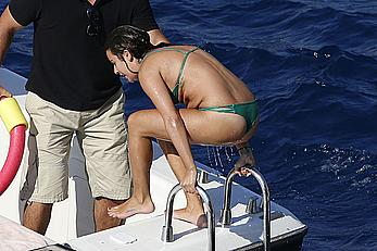 Lea Michele nipple slip in green bikini on a boat in Italy