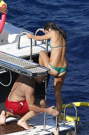 Lea Michele nipple slip in green bikini on a boat in Italy