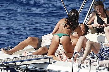 Lea Michele nipple slip in green bikini on a boat in Italy