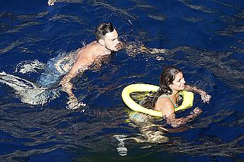 Lea Michele nipple slip in green bikini on a boat in Italy