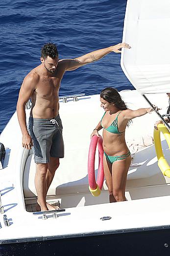 Lea Michele nipple slip in green bikini on a boat in Italy