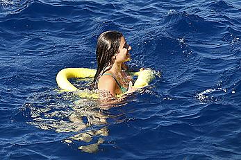 Lea Michele nipple slip in green bikini on a boat in Italy