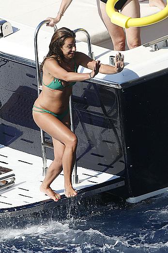 Lea Michele nipple slip in green bikini on a boat in Italy