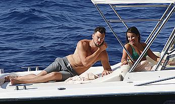 Lea Michele nipple slip in green bikini on a boat in Italy