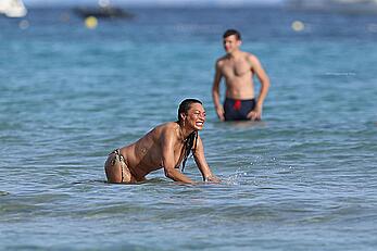 Lilly Becker goes topless at the beach during a sunshine break in Ibiza with friends