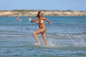 Lilly Becker goes topless at the beach during a sunshine break in Ibiza with friends