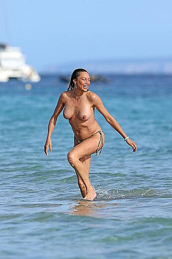 Lilly Becker goes topless at the beach during a sunshine break in Ibiza with friends