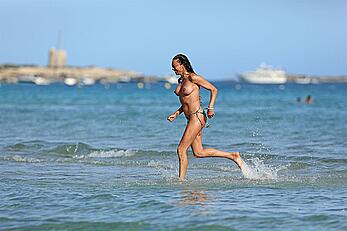 Lilly Becker goes topless at the beach during a sunshine break in Ibiza with friends