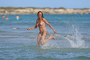 Lilly Becker goes topless at the beach during a sunshine break in Ibiza with friends