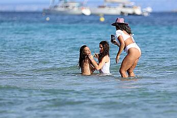 Lilly Becker goes topless at the beach during a sunshine break in Ibiza with friends