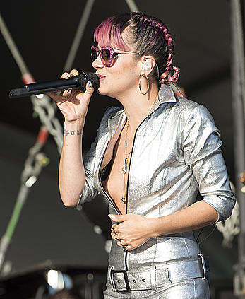 Lily Allen shows titslip on a stage