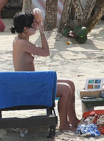 Lily Allen sunbathing topless