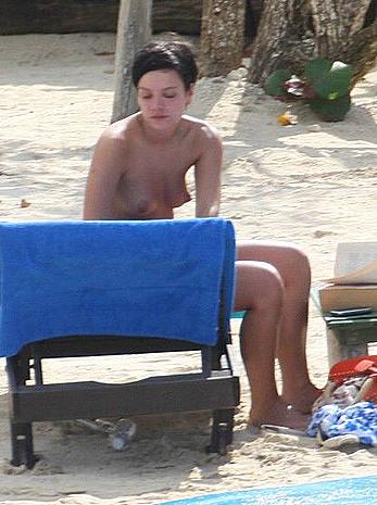 Lily Allen sunbathing topless