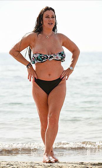 Lisa Appleton nipple slip on a beach in Spain