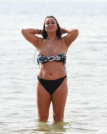 Lisa Appleton nipple slip on a beach in Spain