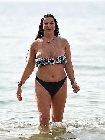 Lisa Appleton nipple slip on a beach in Spain