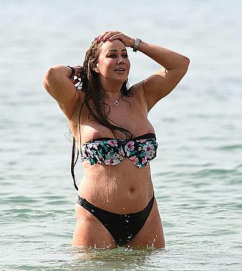 Lisa Appleton nipple slip on a beach in Spain