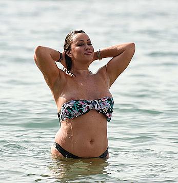 Lisa Appleton nipple slip on a beach in Spain