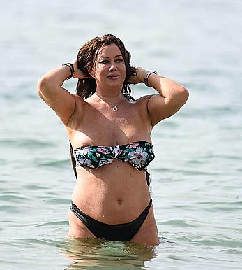 Lisa Appleton nipple slip on a beach in Spain