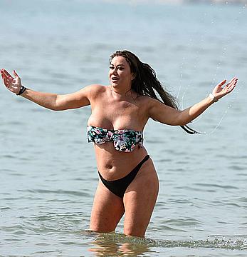 Lisa Appleton nipple slip on a beach in Spain