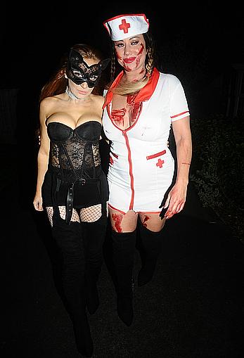 Lisa Appleton flashes her nude boobs in bloody nurse-costume at Halloween Party