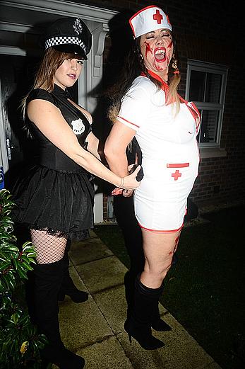 Lisa Appleton flashes her nude boobs in bloody nurse-costume at Halloween Party