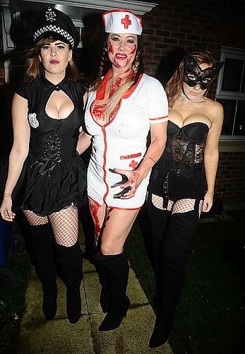 Lisa Appleton flashes her nude boobs in bloody nurse-costume at Halloween Party