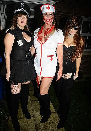 Lisa Appleton flashes her nude boobs in bloody nurse-costume at Halloween Party