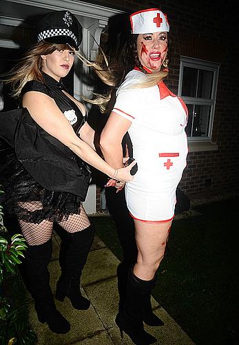 Lisa Appleton flashes her nude boobs in bloody nurse-costume at Halloween Party