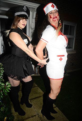 Lisa Appleton flashes her nude boobs in bloody nurse-costume at Halloween Party