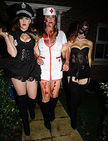 Lisa Appleton flashes her nude boobs in bloody nurse-costume at Halloween Party