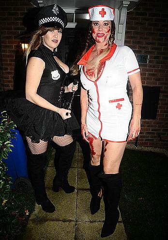 Lisa Appleton flashes her nude boobs in bloody nurse-costume at Halloween Party