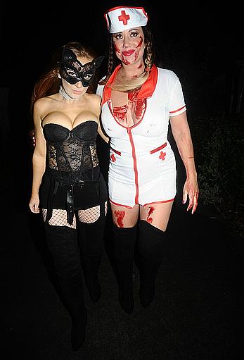 Lisa Appleton flashes her nude boobs in bloody nurse-costume at Halloween Party