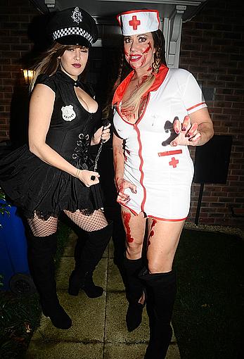 Lisa Appleton flashes her nude boobs in bloody nurse-costume at Halloween Party