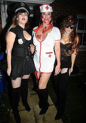 Lisa Appleton flashes her nude boobs in bloody nurse-costume at Halloween Party