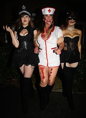 Lisa Appleton flashes her nude boobs in bloody nurse-costume at Halloween Party